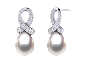 A natural color lustrous TRUE AAA QUALITY Australian South Sea Pearl Earring set features two 9mm South Sea cultured pearls. The Metal is 14K White Gold. The gram weight in this piece is approximately 2.14.