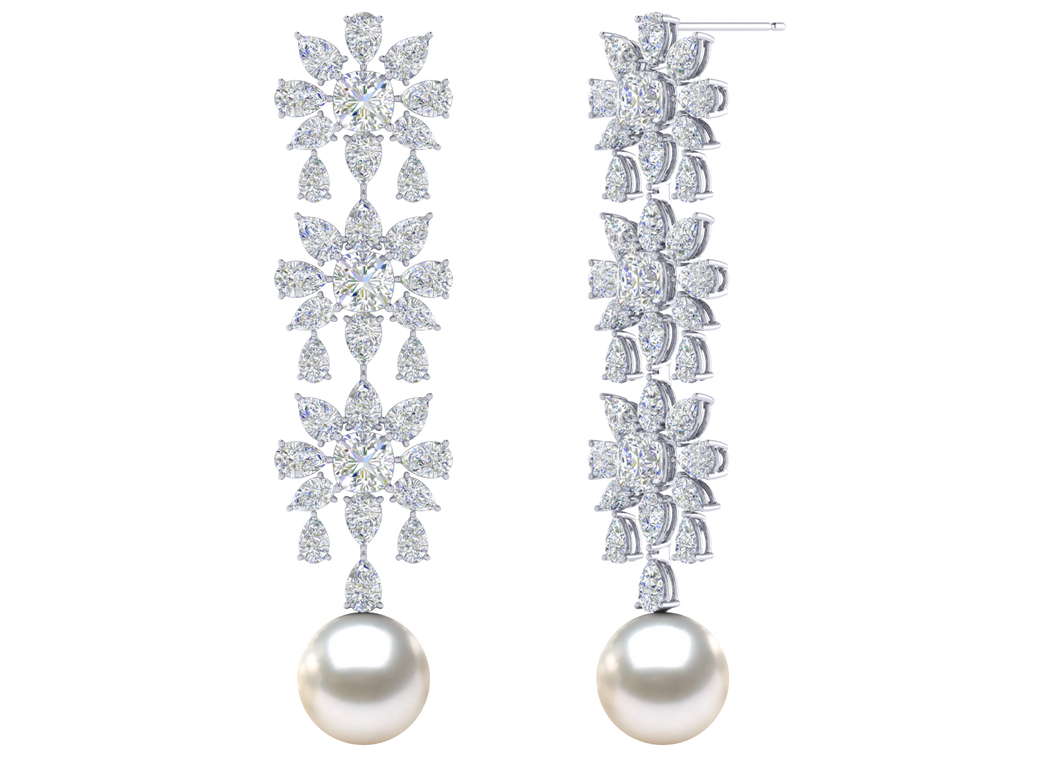 A natural color lustrous TRUE AAA QUALITY Australian South Sea Pearl Earring set features two 8.5mm South Sea cultured pearls. The Metal is 14K White Gold. The gram weight in this piece is approximately 0.45.