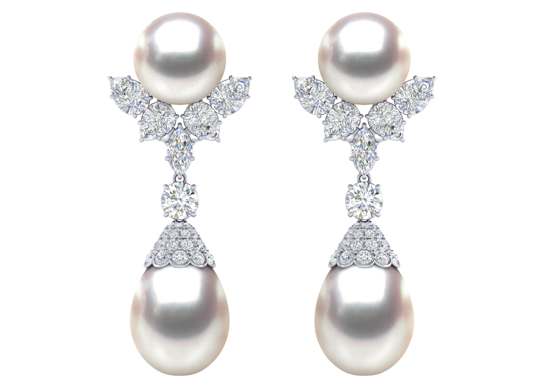 A natural color lustrous TRUE AAA QUALITY Australian South Sea Pearl Earring set features two 8mm South Sea cultured pearls. The Metal is 14K White Gold. The gram weight in this piece is approximately 10.42.