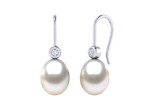 A natural color lustrous TRUE AAA QUALITY Australian South Sea Pearl Earring set features two 8mm South Sea cultured pearls. The Metal is 14K White Gold. The gram weight in this piece is approximately 3.02.