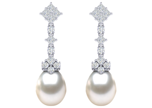 A natural color lustrous TRUE AAA QUALITY Australian South Sea Pearl Earring set features two 15mm South Sea cultured pearls. The Metal is 14K White Gold. The gram weight in this piece is approximately 3.2.